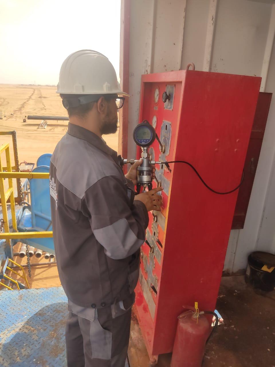 Field technician operating technical measurement tools