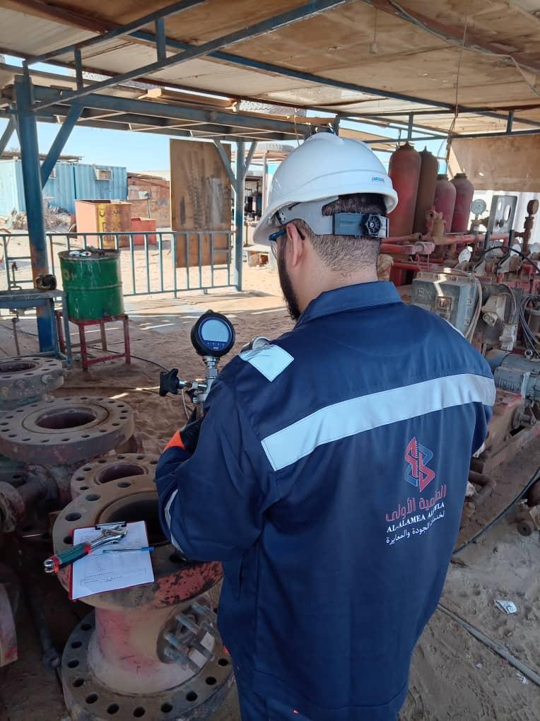 Technician reviewing industrial site equipment